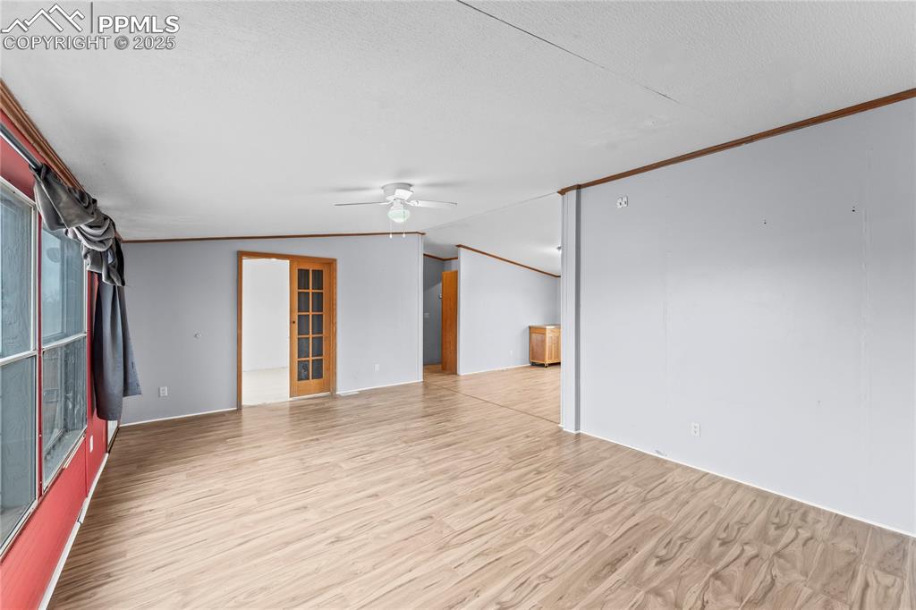 41275 Truckton Road Rush, CO 80833 - Photo 5 of 32 a view of empty room with wooden floor and fan