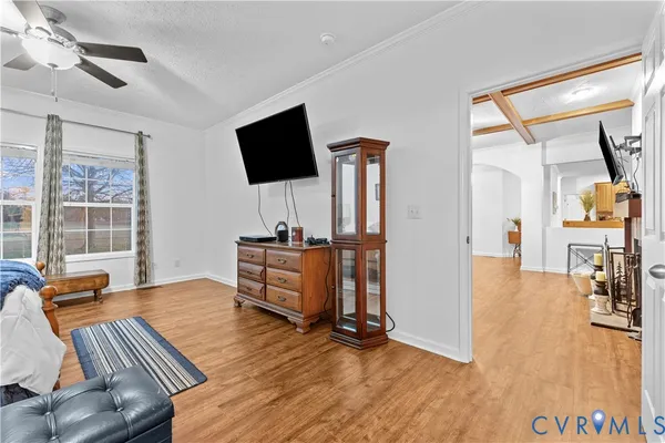 a bed room with a bed and a television