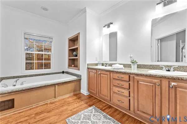 a white bath tub sitting next to a window