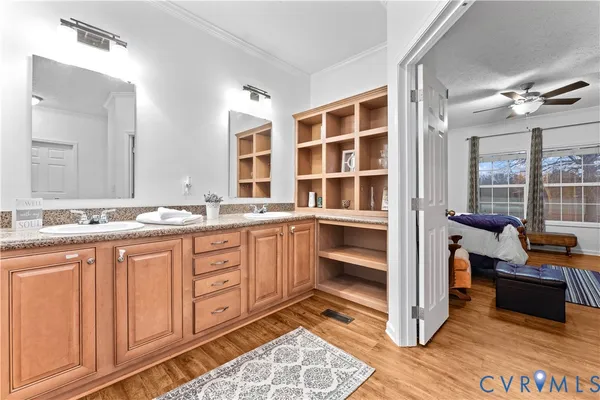 a kitchen with stainless steel appliances kitchen island granite countertop a stove a sink a microwave a dining table and chairs