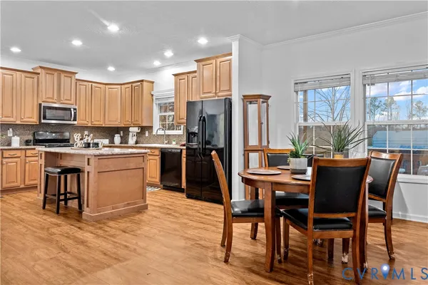 a dining room with furniture and window