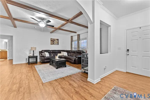 a living room with fireplace furniture and a flat screen tv
