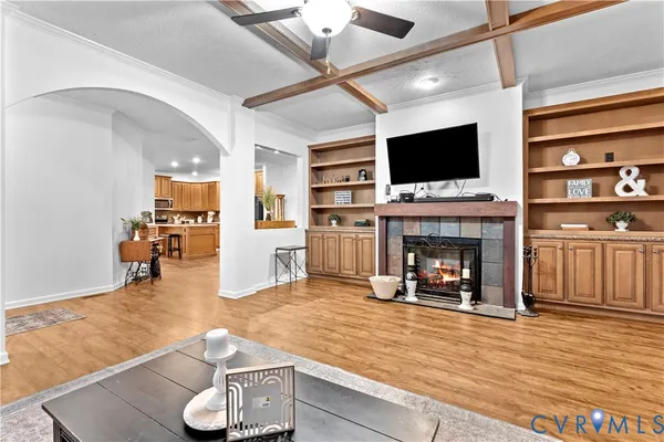 a spacious bedroom with a bed and wooden floor