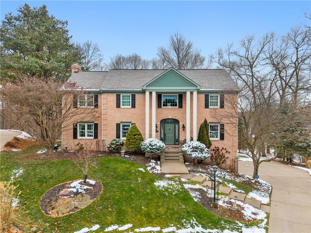 520 Colony Court Gibsonia, PA 15044 - Photo 1 of 45 a front view of a house with a garden