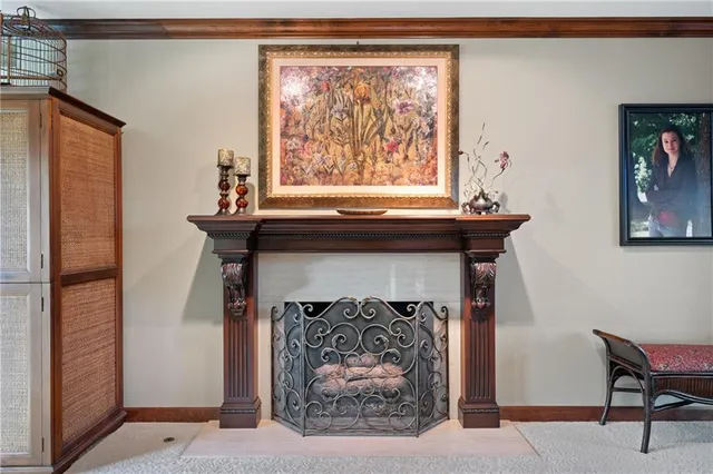 a living room with a fireplace and a window