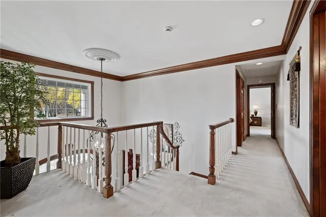 a view of a hallway with staircase
