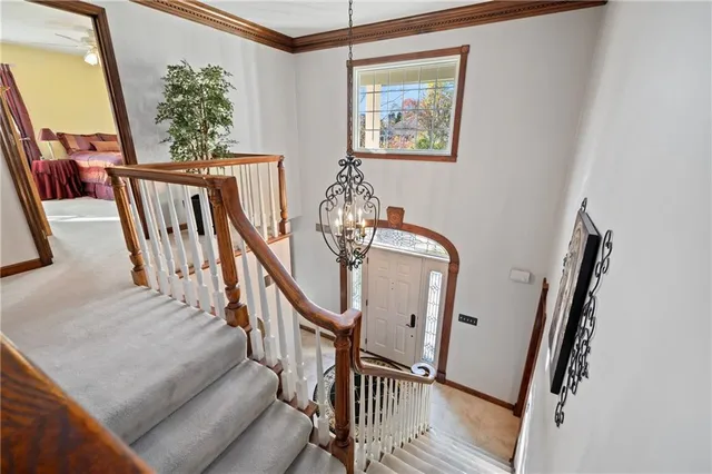 a view of staircase with wooden floor and windows