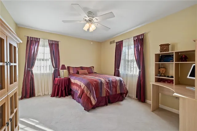 a bed room with a bed and a window