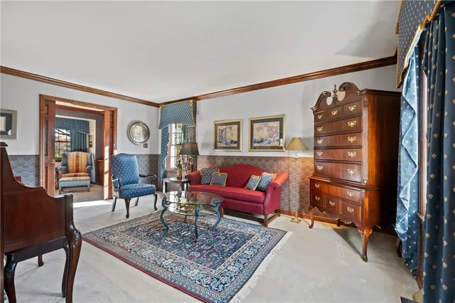 a living room with furniture and a rug