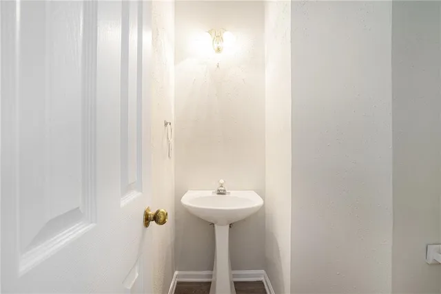 a bathroom with a sink a mirror and a shower