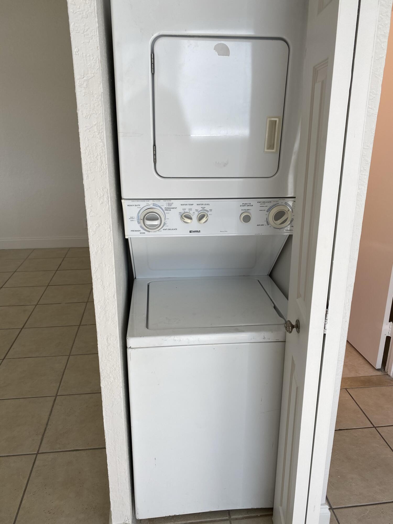 100 Nottingham Circle, Unit J Greenacres, FL 33463 - Photo 8 of 10 a utility room with dryer and washer