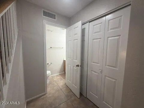 a bathroom with a granite countertop sink and a shower