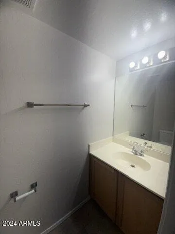 a bathroom with a sink and mirror