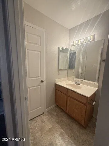 a bathroom with 2 sink and a mirror