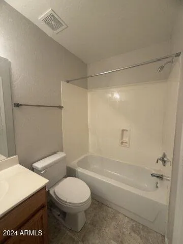 a bathroom with a toilet a sink and shower