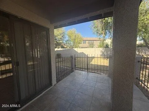 a view of a room with wooden floor and windows