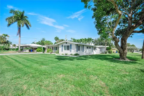 a view of a house with a big yard