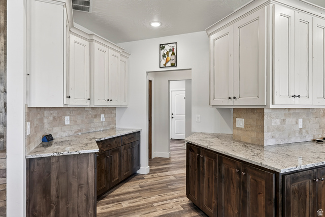 3311 West Allard Summit, UT 84772 - Photo 24 of 97 Kitchen featuring two-tone cabinetry with white upper cabinets and dark wood-finish lower cabinets