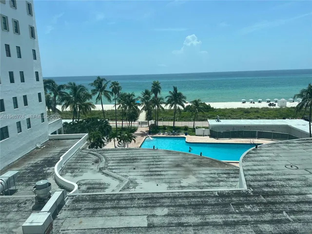 a view of a swimming pool with an ocean view