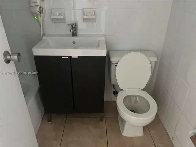 a bathroom with a toilet and a sink
