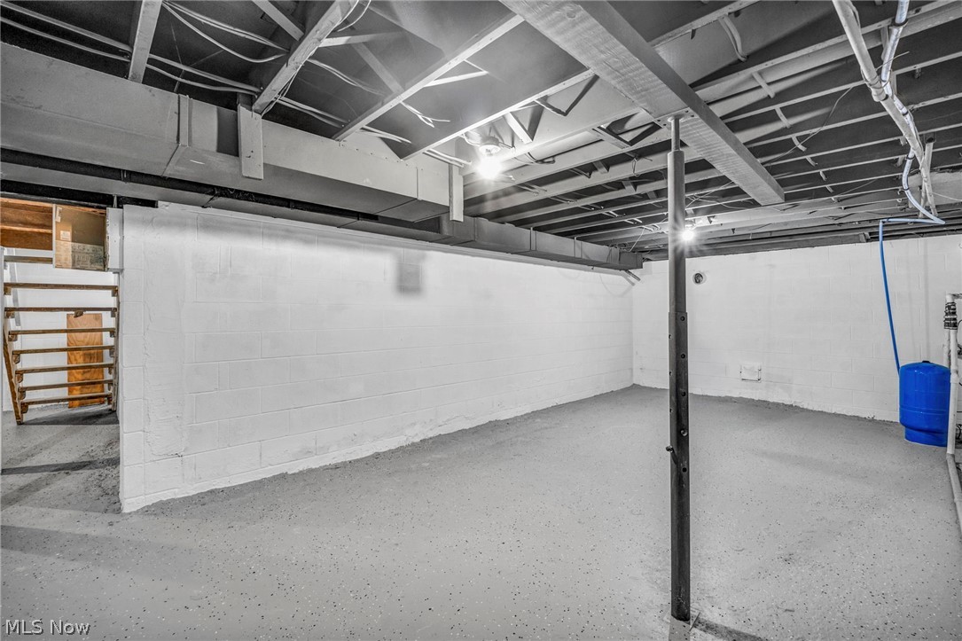 3759 Herr Fieldhouse Road Southington, OH 44470 - Photo 26 of 35 Spacious warehouse or commercial space featuring polished concrete flooring, exposed ceiling infrastructure with integrated lighting, and clean white walls