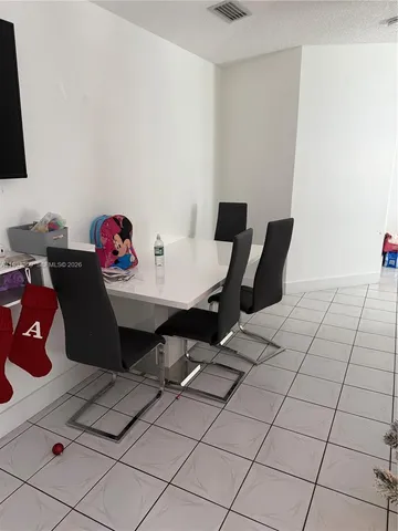 a bedroom with a bed and dresser