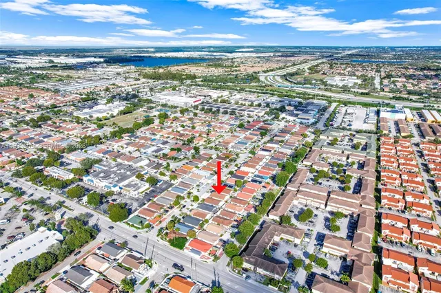 an aerial view of residential building with an outdoor space