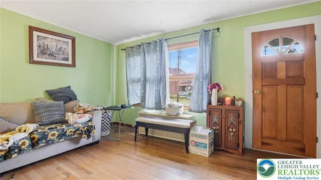 a kitchen with stainless steel appliances granite countertop a stove refrigerator sink dining table and chairs