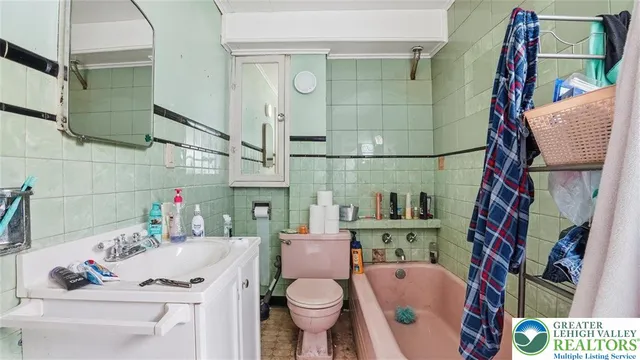 a view of a chair and tables in the backyard