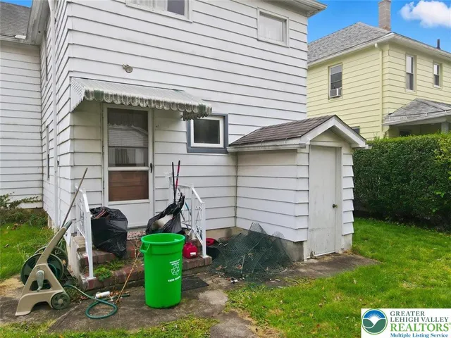 a picture of a bench in front of a building