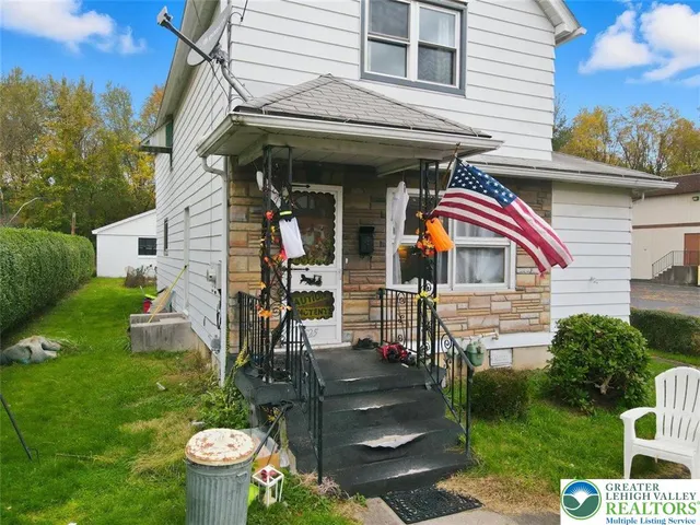 a view of a livingroom with furniture and a flat screen tv
