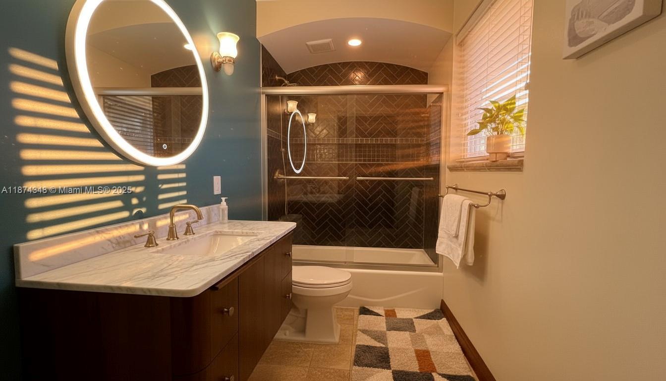 40 Southwest 30th Road Miami, FL 33129 - Photo 14 of 54 a bathroom with a sink and a mirror