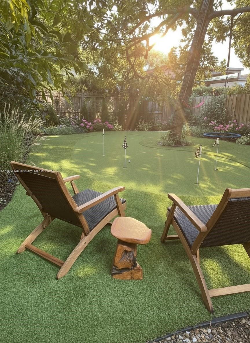 40 Southwest 30th Road Miami, FL 33129 - Photo 17 of 54 a view of a swimming pool and lounge chairs in the garden