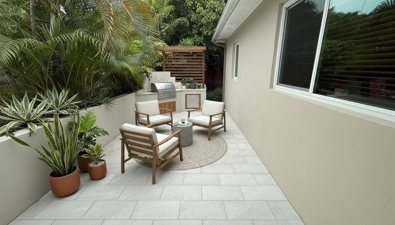 40 Southwest 30th Road Miami, FL 33129 - Photo 18 of 54 a view of a patio with chairs and potted plants