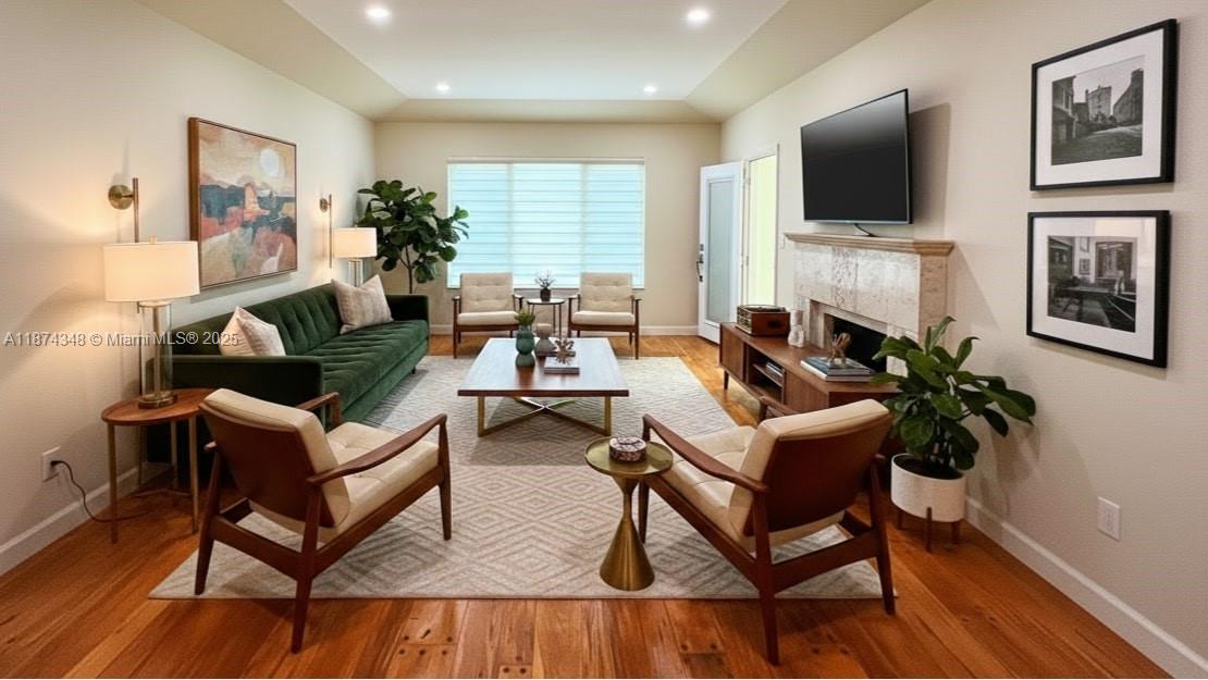 40 Southwest 30th Road Miami, FL 33129 - Photo 30 of 54 a living room with furniture a flat screen tv and a fireplace