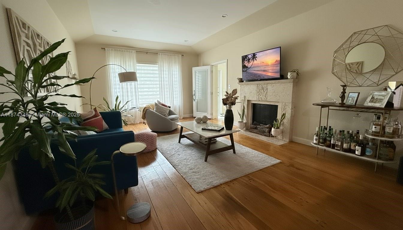 40 Southwest 30th Road Miami, FL 33129 - Photo 31 of 54 a living room with furniture and a fireplace