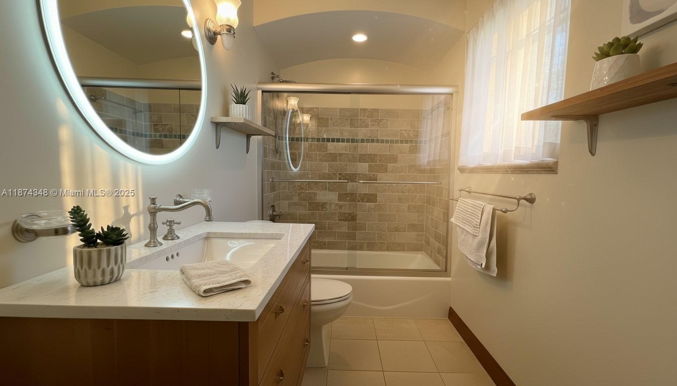 40 Southwest 30th Road Miami, FL 33129 - Photo 43 of 54 a bathroom with a sink a mirror and a shower