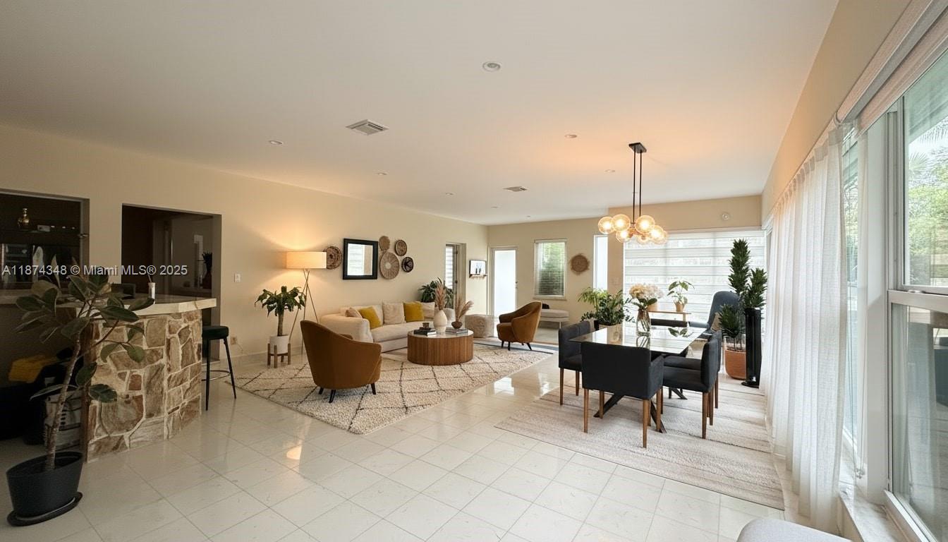 40 Southwest 30th Road Miami, FL 33129 - Photo 5 of 54 a living room with furniture and a large window