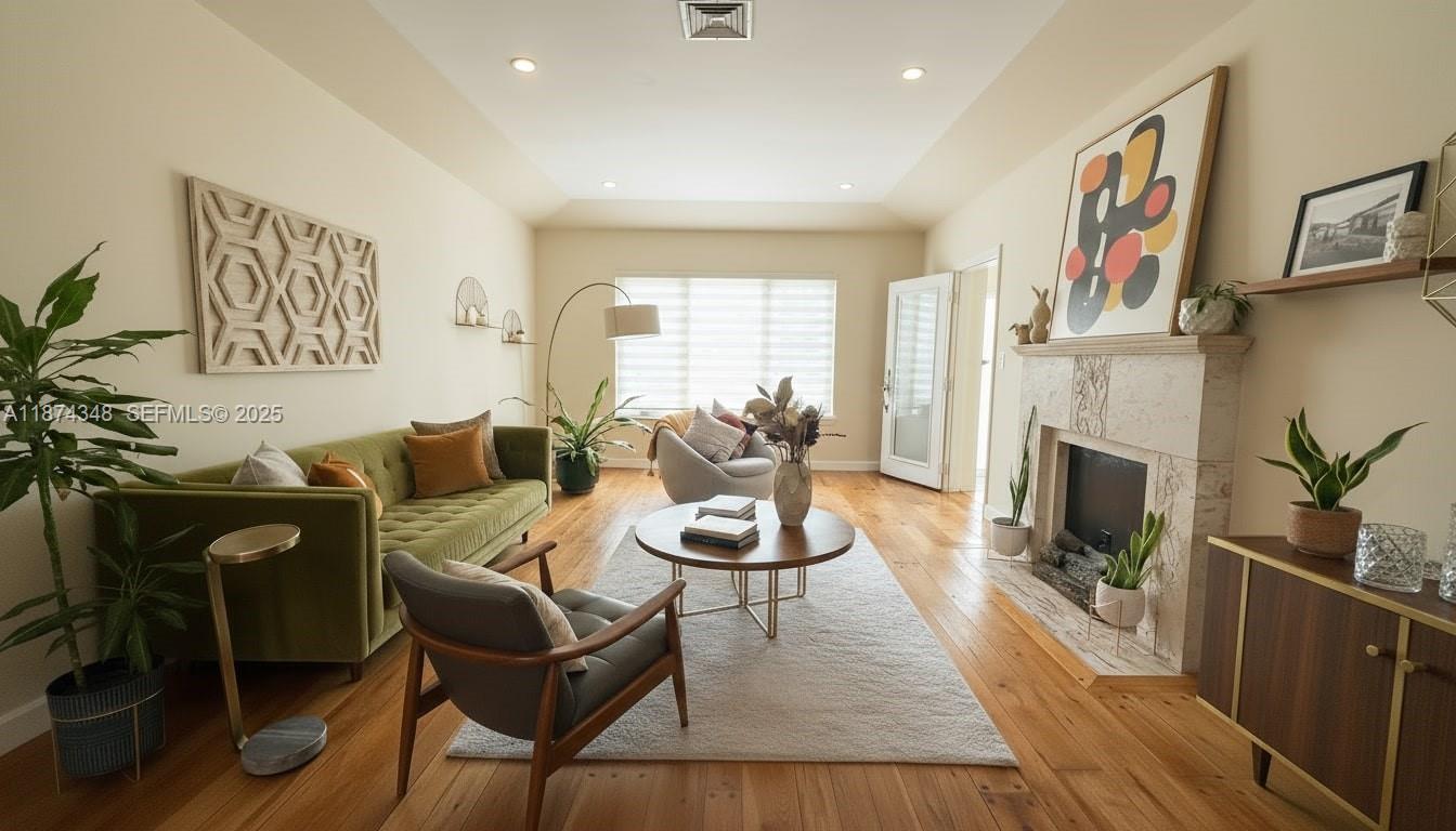 40 Southwest 30th Road Miami, FL 33129 - Photo 7 of 54 a living room with furniture and a fireplace