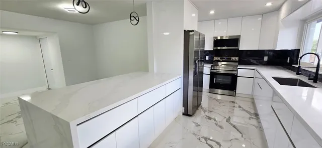 a view of a hallway with seating area