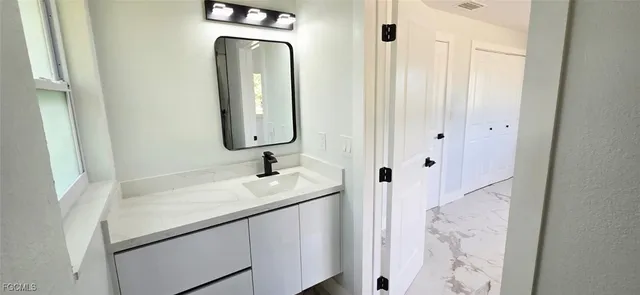 a bathroom with a sink and a toilet