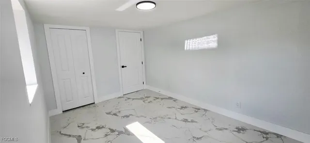 a view of an empty room and window