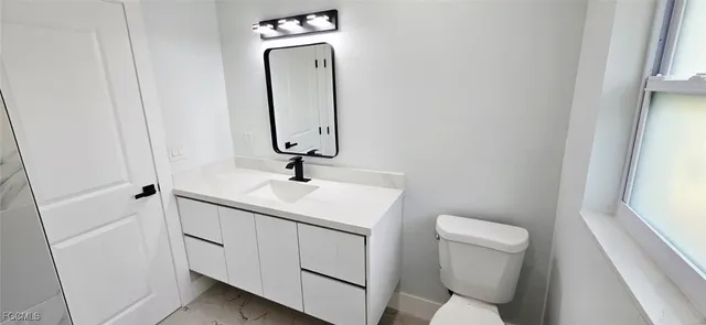 a view of a house with yard and a garden