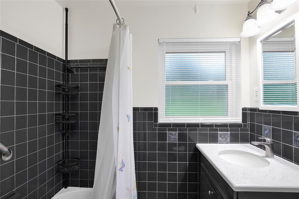 2313 River Ridge Road DeLand, FL 32720 - Photo 27 of 63 a bathroom with a sink toilet shower and window