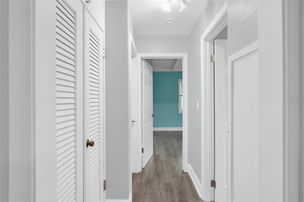 2313 River Ridge Road DeLand, FL 32720 - Photo 28 of 63 a view of a hallway with wooden floor