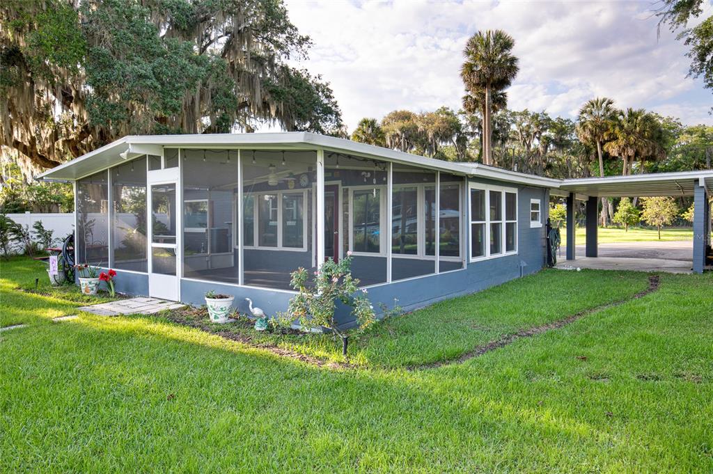 2313 River Ridge Road DeLand, FL 32720 - Photo 38 of 63 a view of a house with backyard and garden