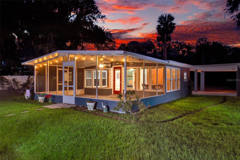2313 River Ridge Road DeLand, FL 32720 - Photo 39 of 63 a view of a house with a yard porch and sitting area