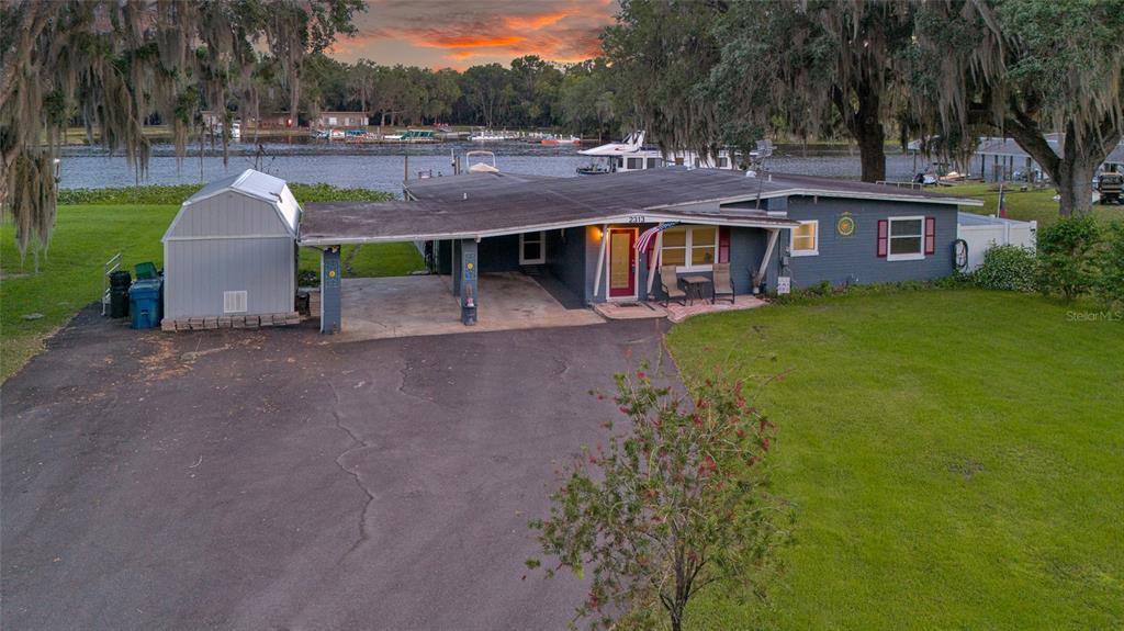 2313 River Ridge Road DeLand, FL 32720 - Photo 49 of 63 a view of a house with a yard