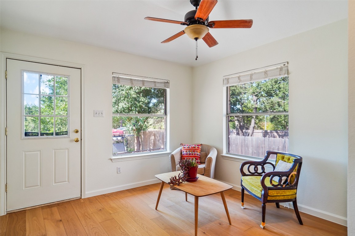 1422 Wheatfall Lane Austin, TX 78748 - Photo 13 of 29 a living room with furniture and a window