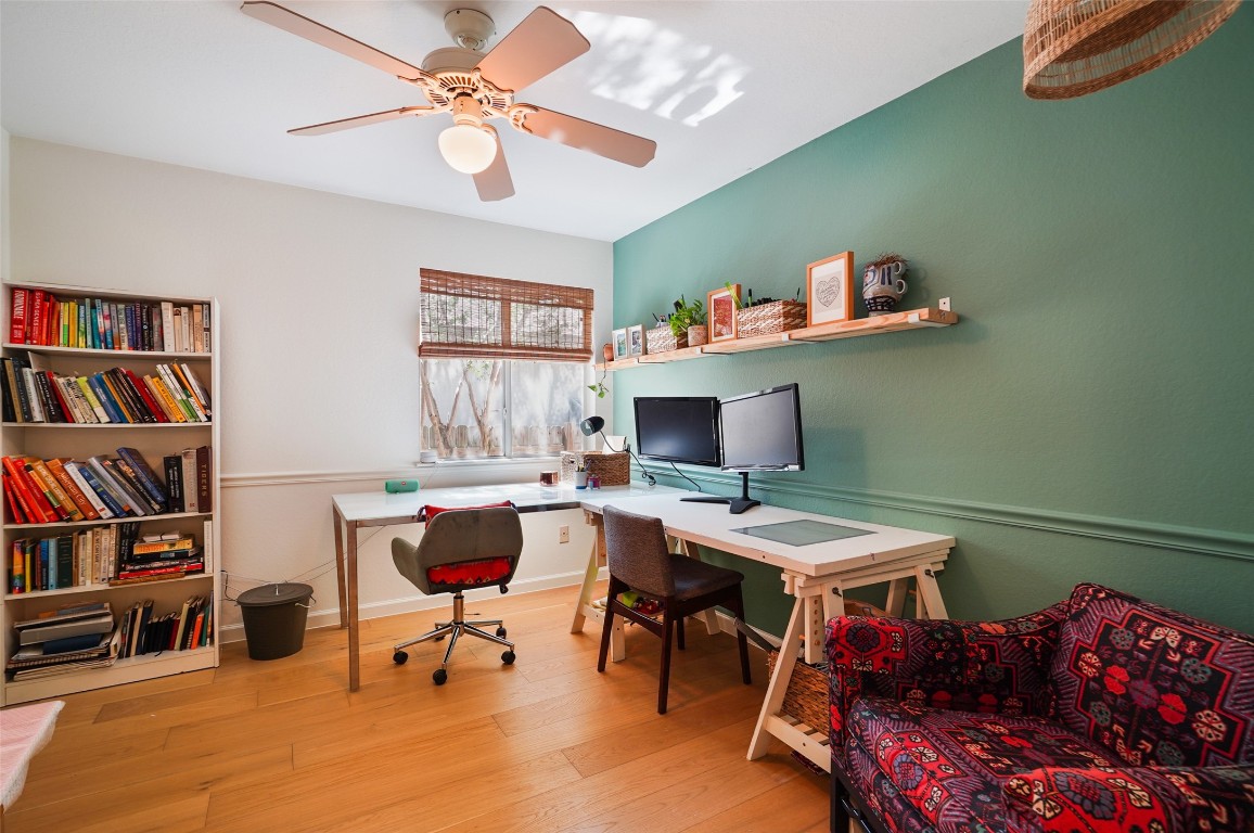 1422 Wheatfall Lane Austin, TX 78748 - Photo 18 of 29 a workspace with a bookshelf
